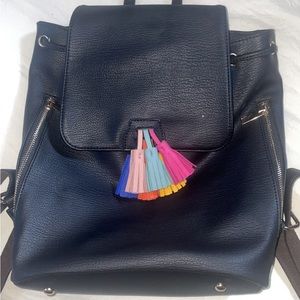 Black leather backpack with multi-color tassel